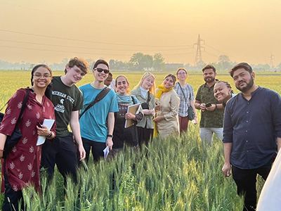 Students stand in wheat field