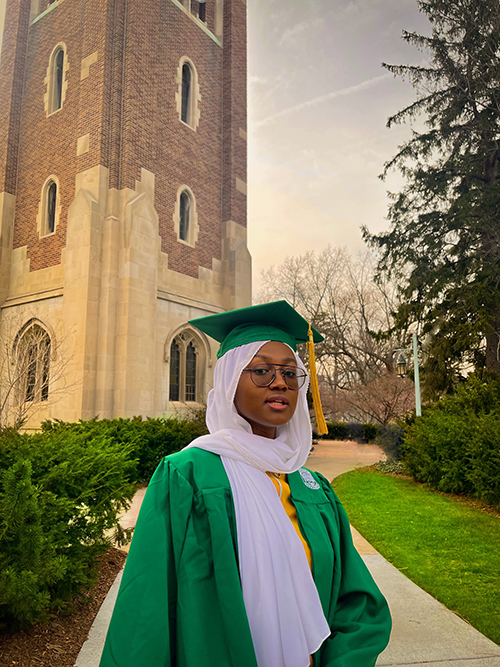 myrah beverly standing in front of Beaumont Tower