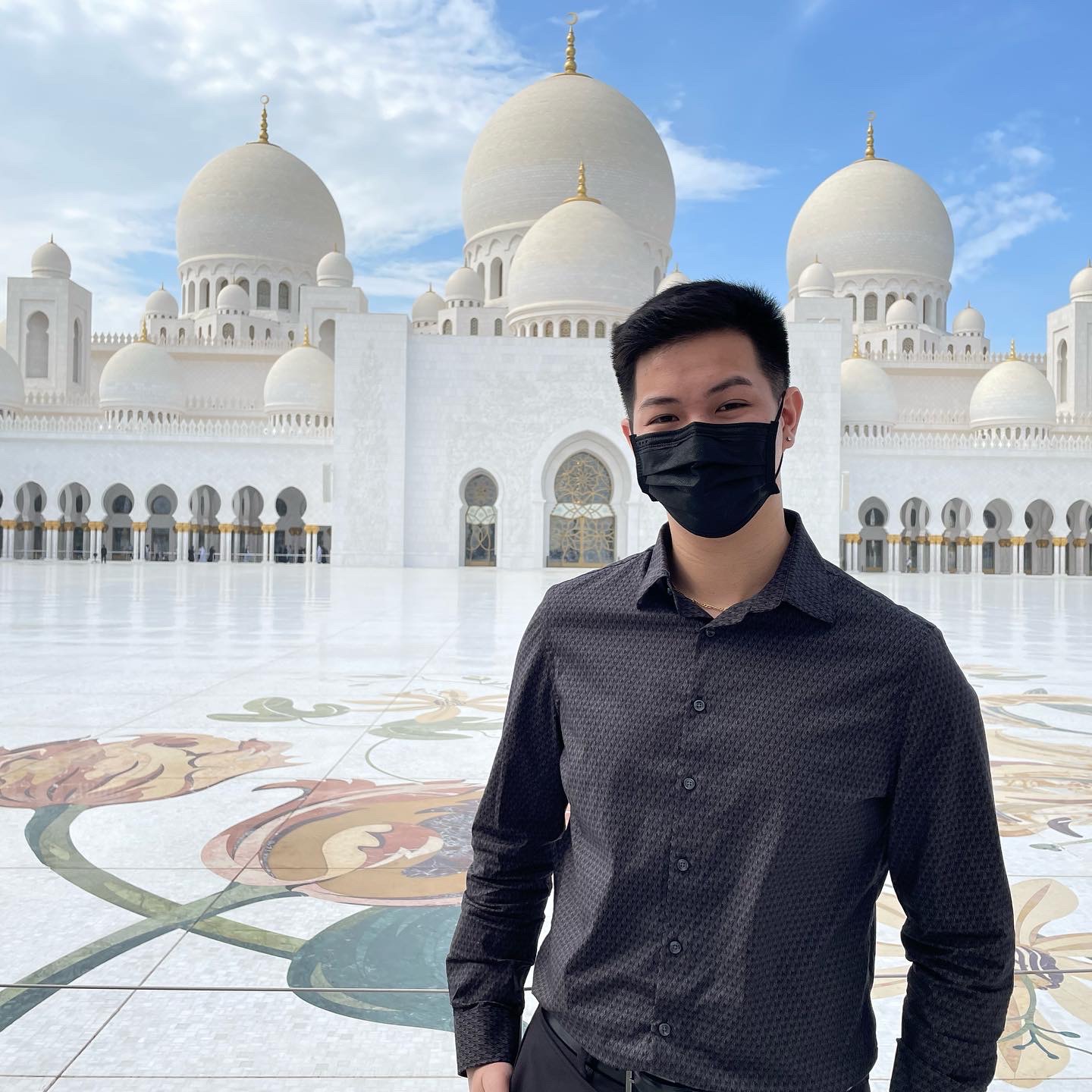 David standing in front of a mosque in UAE.
