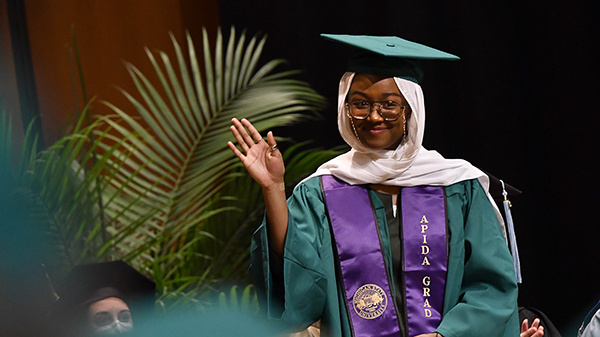 myrah beverly walking to podium to deliver commencement speech