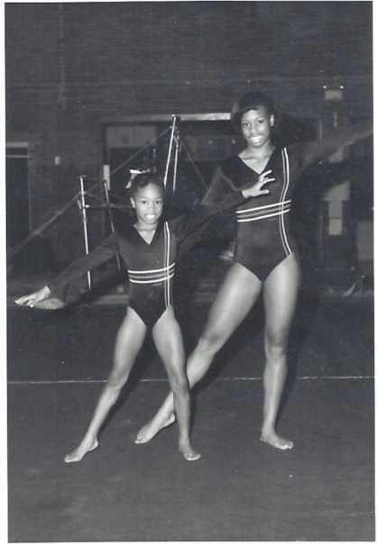 Melissa Green (left) as a child at gymnastics with her older sister Alysia (right) at Great Lakes Gymnastics.