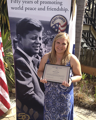 Shannon accepting award for Peace Corps service