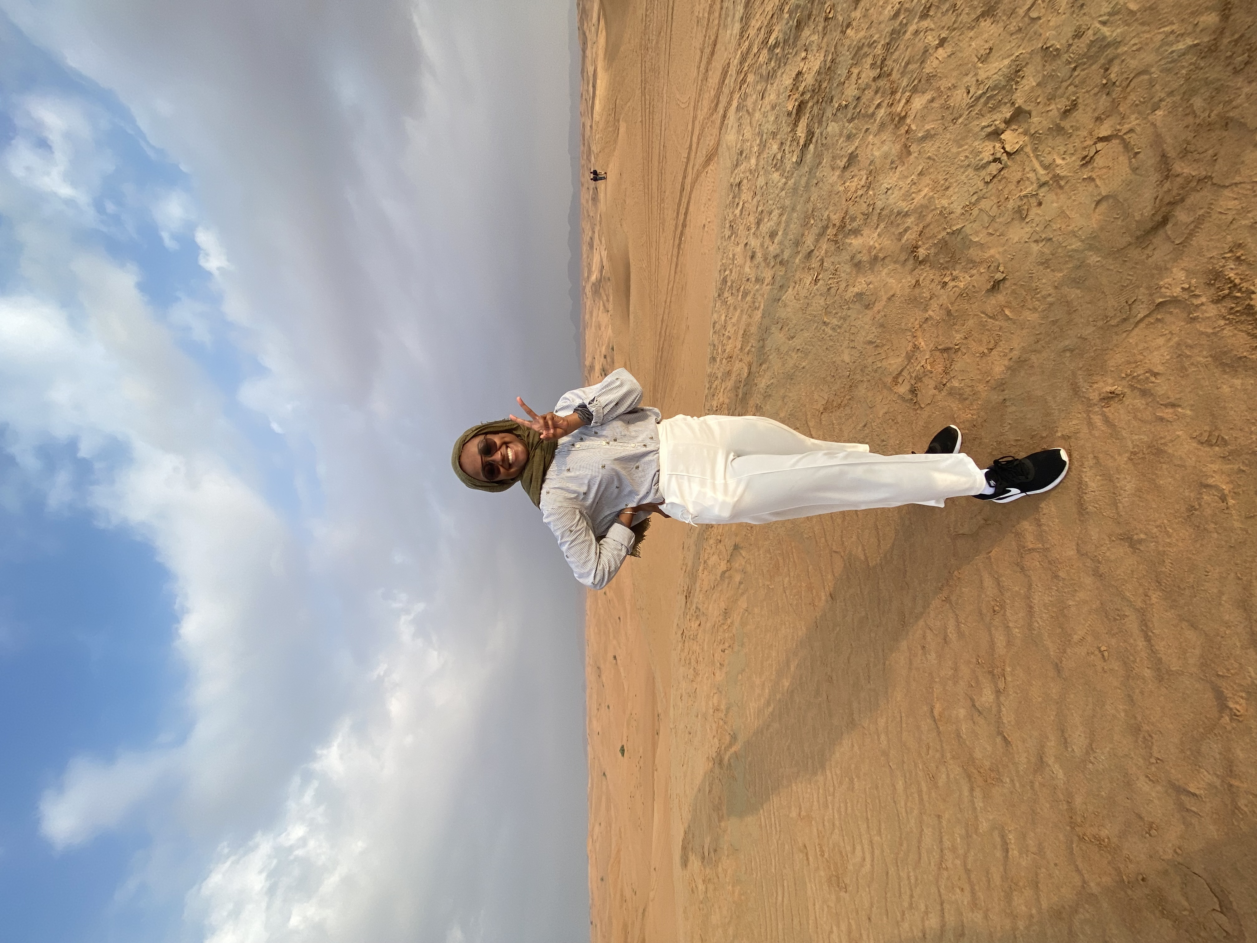 Myrah standing in the Sharjah Desert.