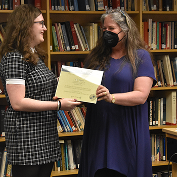 Student receives award from Prof. Aronoff